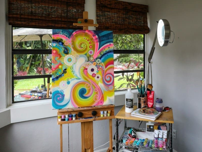 A painting of swirls and colors on canvas.