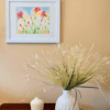 A vase with flowers in it on the table