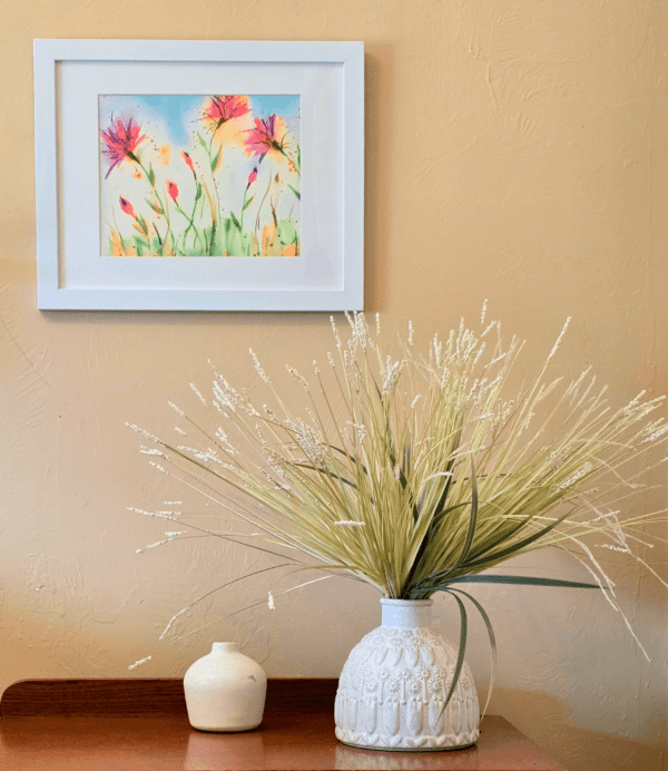 A vase with flowers in it on the table