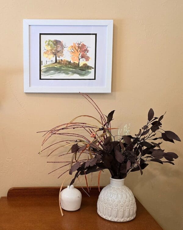 A painting of a tree in the background and two vases with flowers on them.