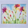 A painting of flowers in the grass.